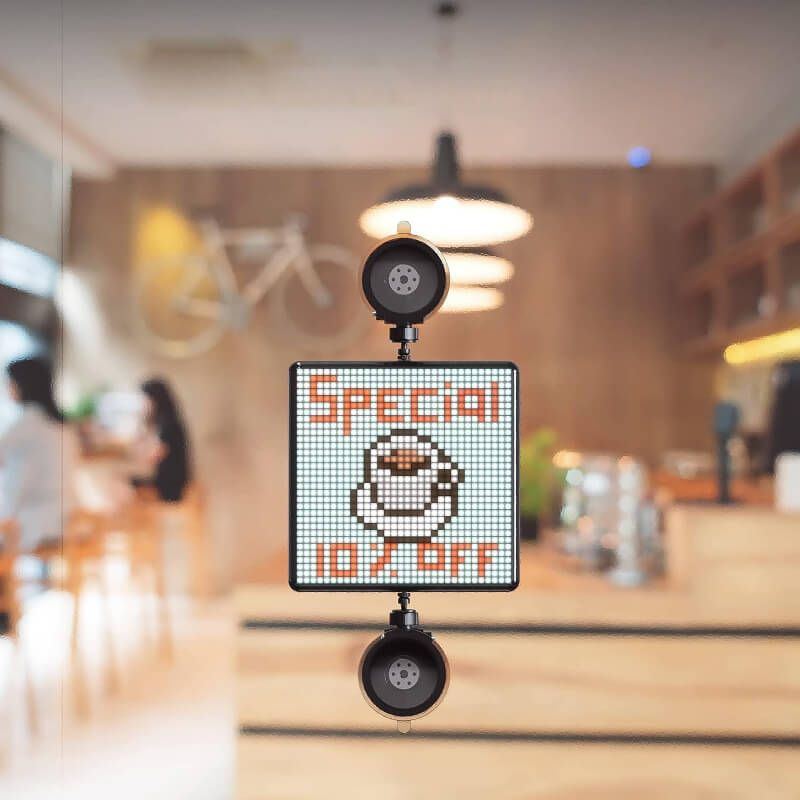 Car pixel LED display showcasing a special offer with coffee icon and vibrant pixel lighting in a cafe setting.