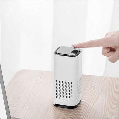 AirPure™ Mini Portable Pet Air Purifier on a table, showcasing its compact design and easy-to-use button.